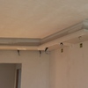 Abbassamento soffitto in una sala con perimetro di metri 6 per 5 solo nella zona perimetrale con faretti e luci led più abbassamento nel corridoio largo metri uno e trenta e lungo 4 metri