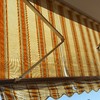Riparazione telo tenda da sole a bracci manuale