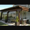 Realizzazione veranda con infissi in legno come da foto