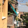 Tenda antipioggia più tenda da sole