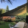 Lavaggio tenda da sole in giardino a lainate